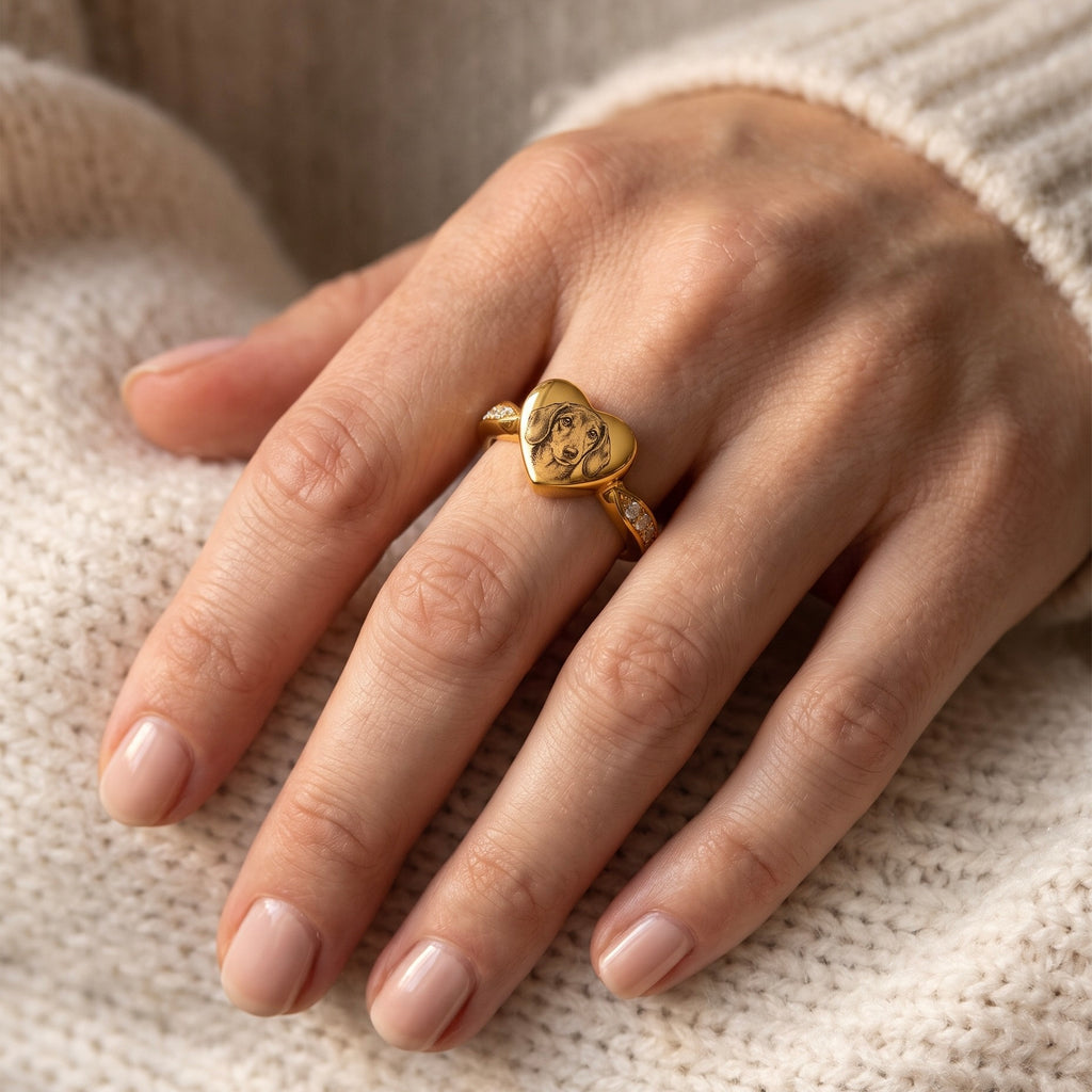 Close-up of a gold heart memorial ring personalized with a Dachshund portrait
