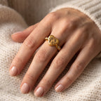 Close-up of a gold heart memorial ring personalized with a Dachshund portrait