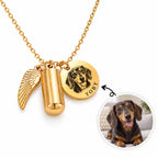 Personalized gold pet urn necklace with custom engraved dog portrait medallion, keepsake ashes capsule, and wing charm.