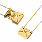Gold custom envelope necklace shown closed and open with an engraved dog portrait on the inner card