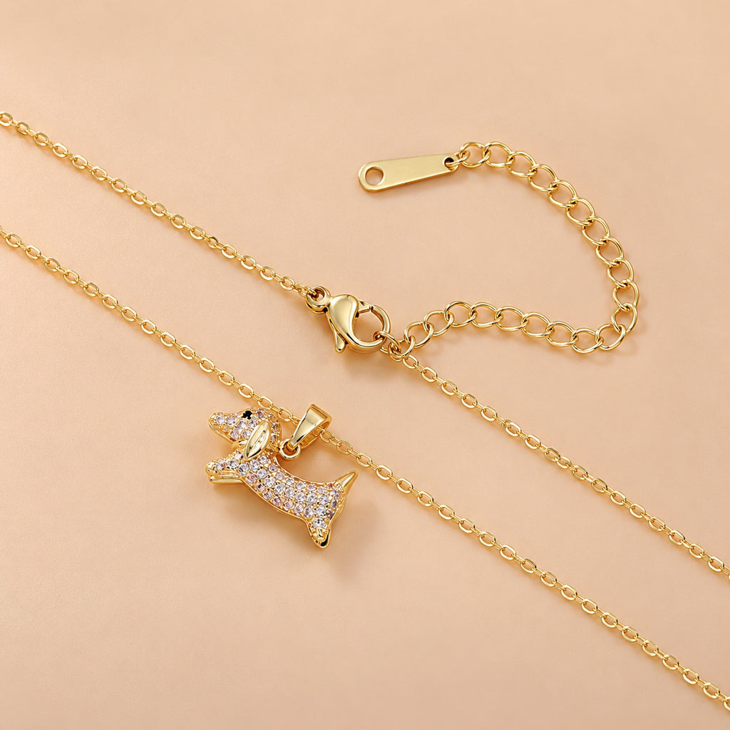 Gold-tone dachshund pendant necklace with chain, lobster clasp and extender detail
