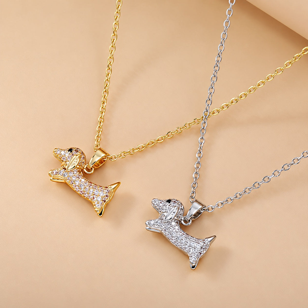 Gold-tone and silver-tone dachshund pendant necklaces with clear cubic zirconia accents