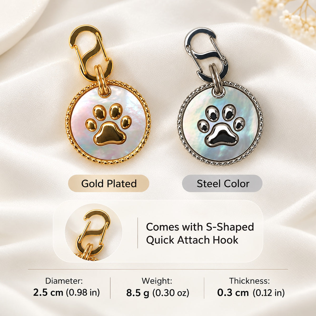 Gold and silver mother-of-pearl dog tags with S-shaped hooks and size, weight and thickness details
