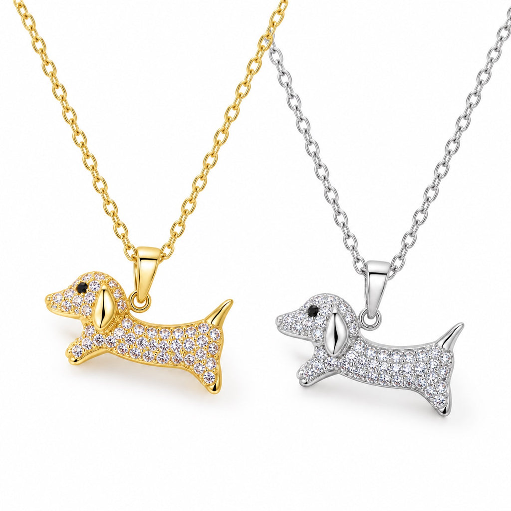 Close-up of gold-tone and silver-tone sparkling dachshund dog pendant necklaces