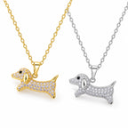 Close-up of gold-tone and silver-tone sparkling dachshund dog pendant necklaces