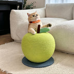 Indoor cat rubbing against an apple-shaped scratcher