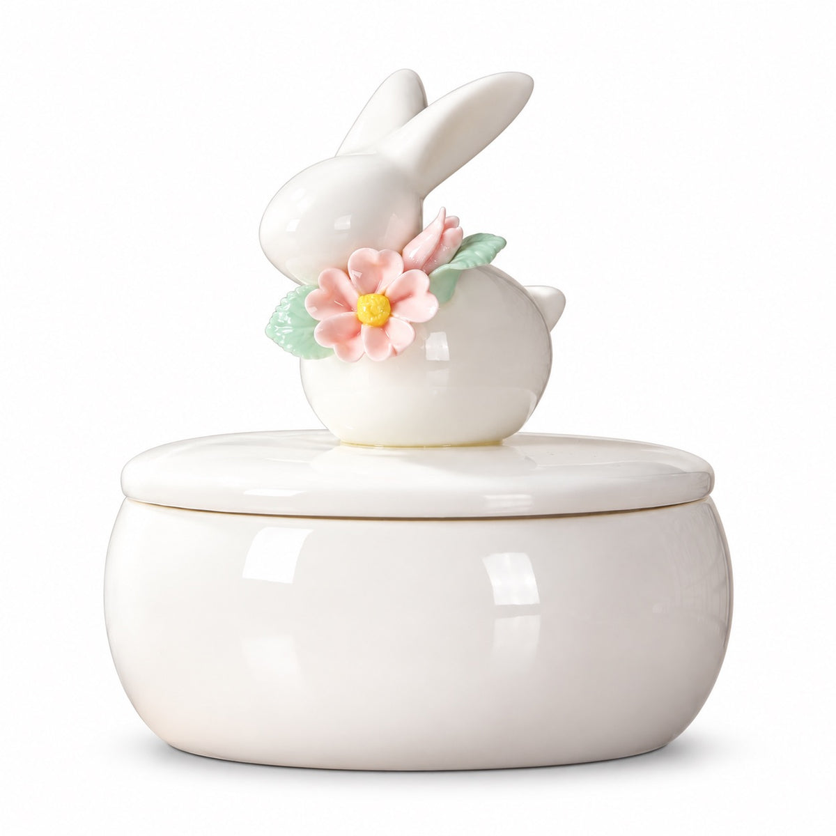 Ivory ceramic rabbit memorial urn with a removable lid decorated with a rabbit figure, pink flowers and green leaves |