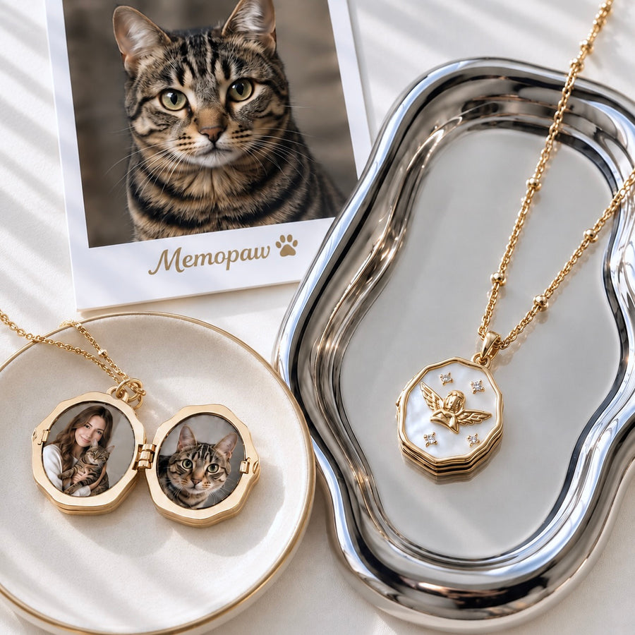 Gold custom pet memorial locket necklace open with photo inserts of a woman and a tabby cat, displayed on a silver dish next to a pet photo print.