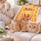 Closer sofa view of the yellow Millie cat portrait blanket with two orange cats and a matching cat cushion