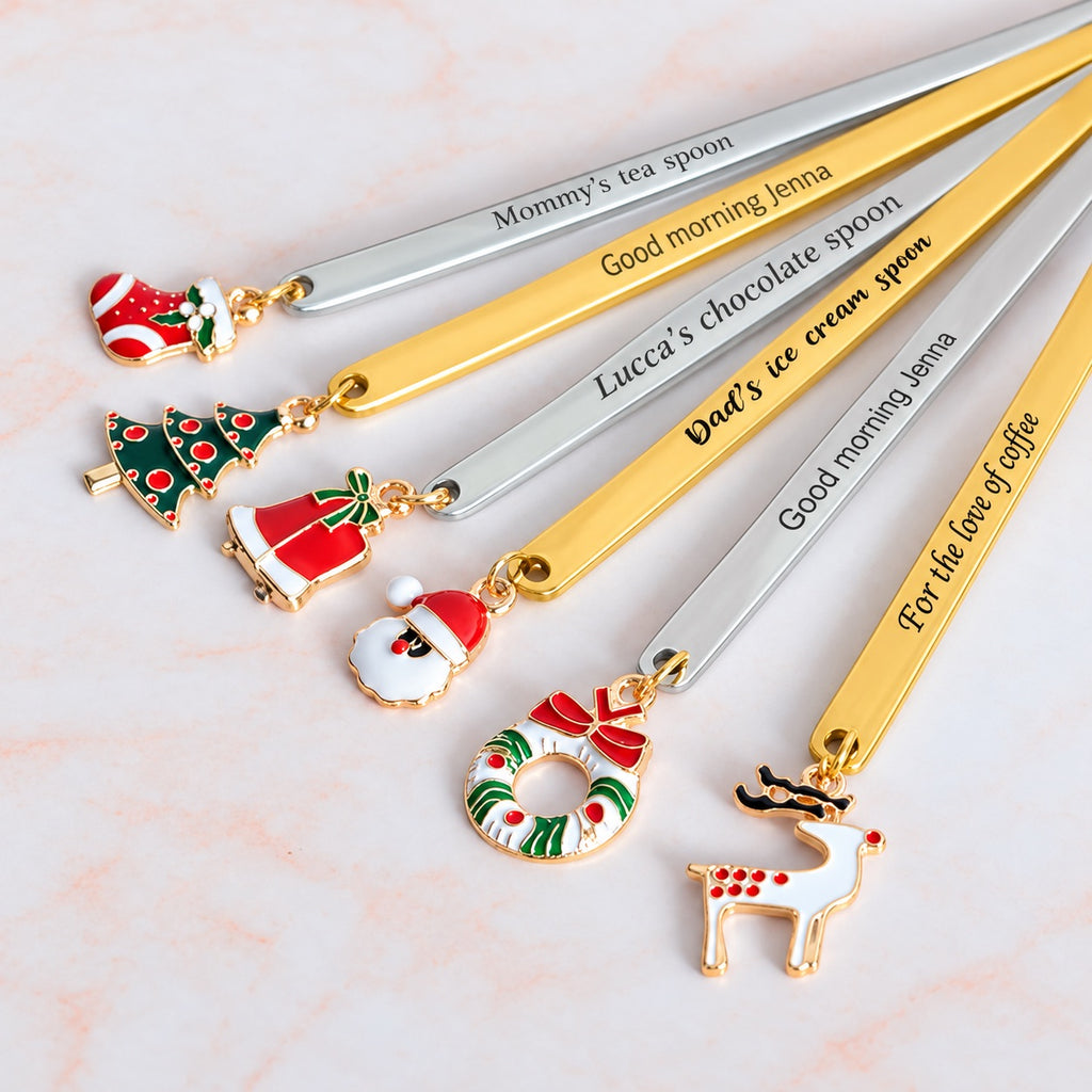 Gold-tone and silver-tone personalized Christmas spoons with stocking, tree, bells, Santa, wreath and reindeer charms