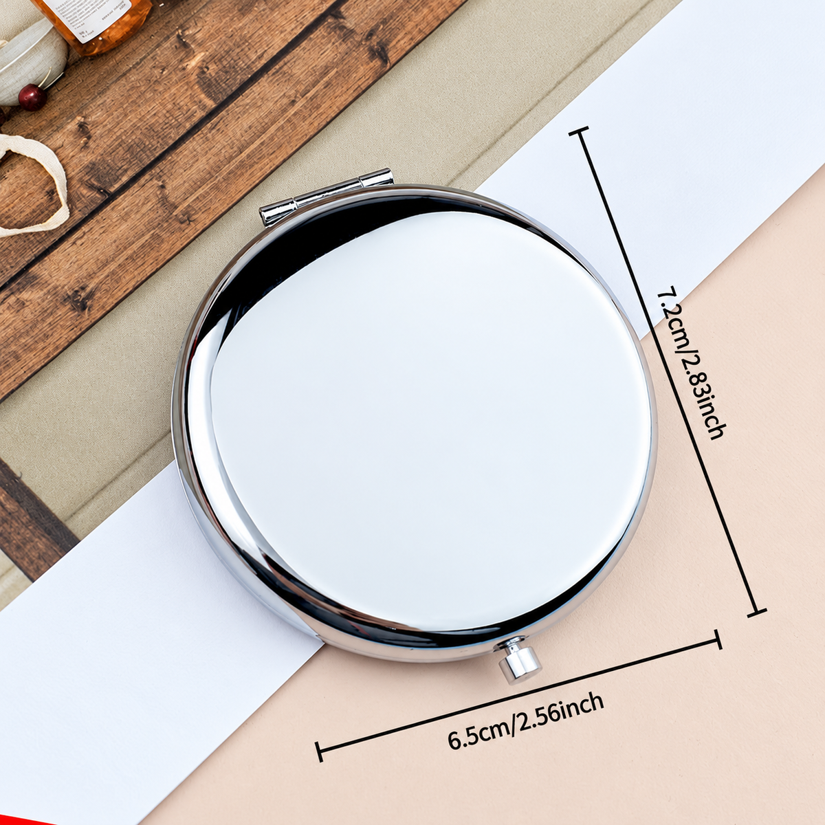 Size guide for round compact mirror measuring 2.83 inches high and 2.56 inches wide