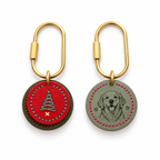 Red and green cowhide Christmas dog tag showing a stitched tree front and custom pet portrait reverse with brass screw-lock clasps