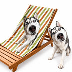 Personalized Siberian Husky photo microfiber beach towel on a lounge chair with real dog comparison.