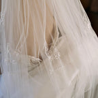 Custom bridal veil with three embroidered pet portraits and names for a pet-friendly wedding