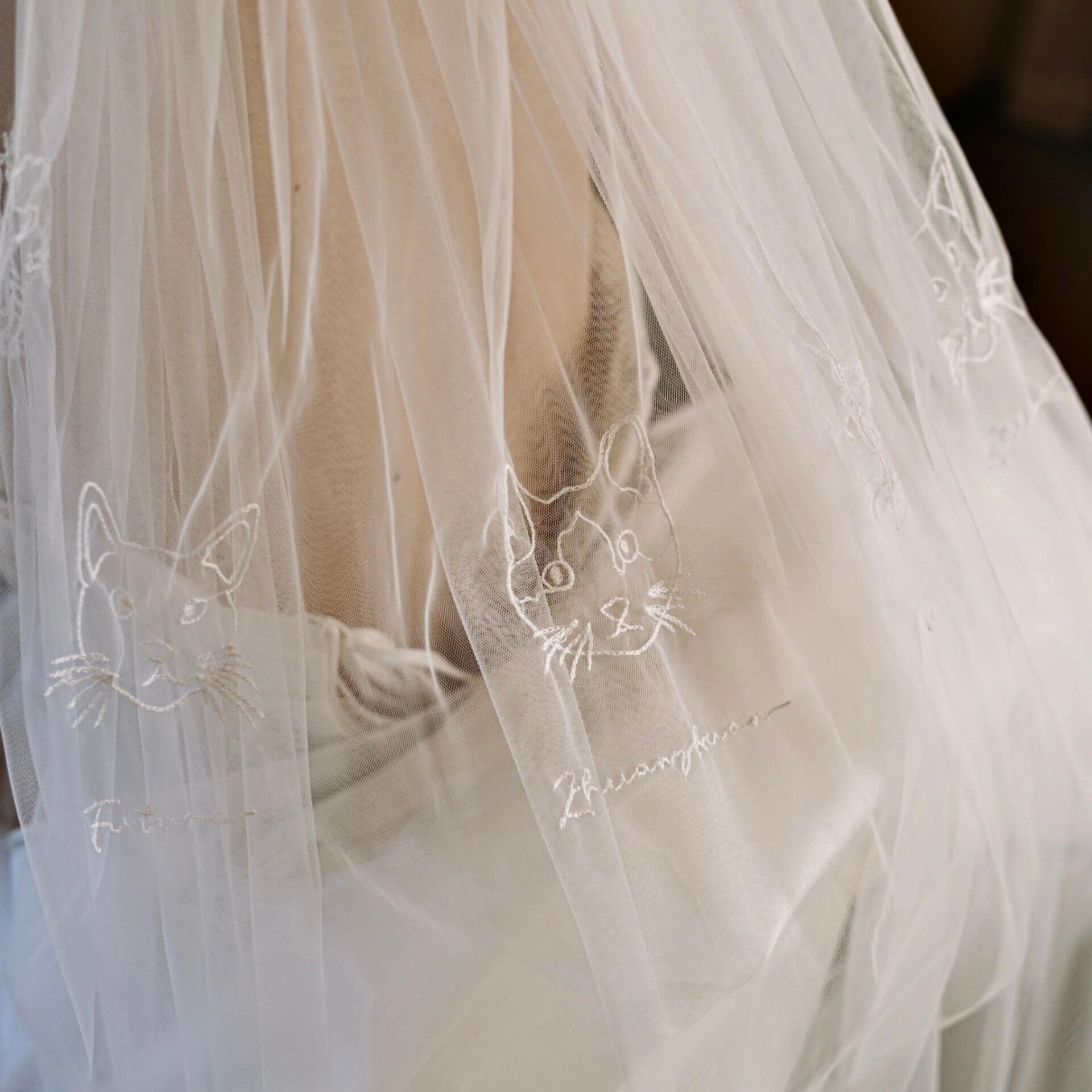 Custom bridal veil with three embroidered pet portraits and names for a pet-friendly wedding