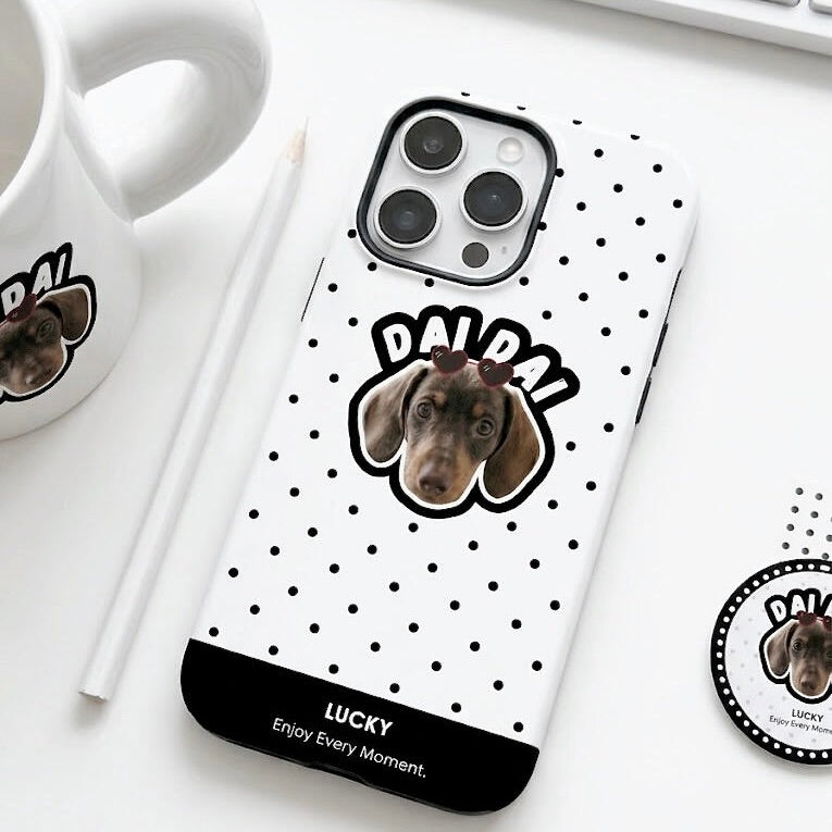 Personalized pet photo gift box set including a custom dog portrait coffee mug, travel tumbler, phone case, and matching round badge on a white background with black polka dots.