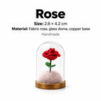 Miniature red fabric rose keepsake under a clear dome with a copper-tone base and size details