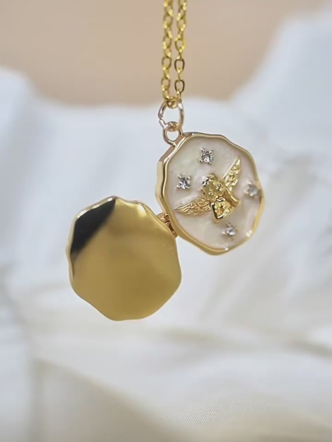 Open gold personalized pet memorial locket necklace featuring a detailed angel design