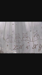 Close-up video of a luxury bridal wedding veil featuring intricate hand-stitched custom dog embroidery, perfect pet-themed bridal wear for dog moms.