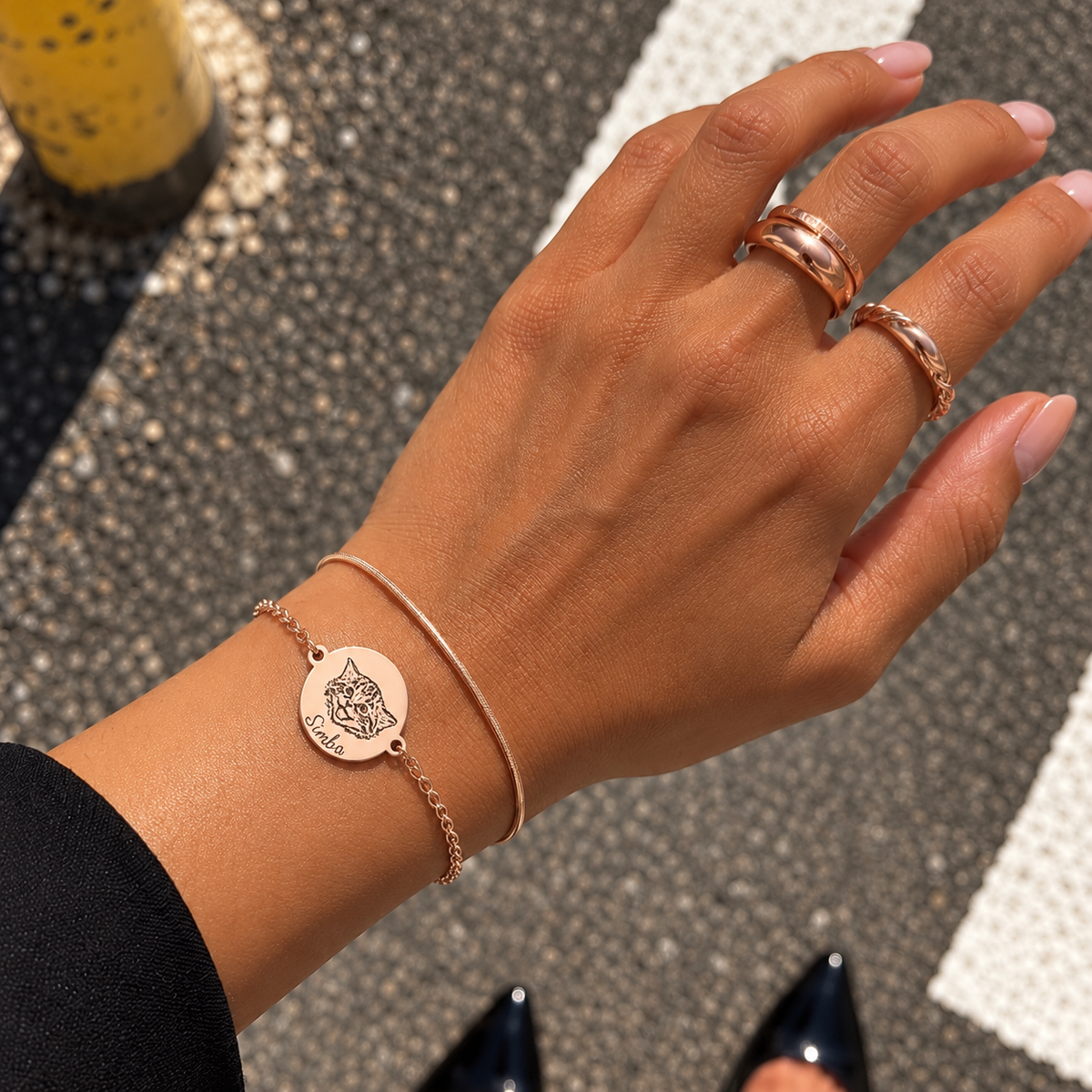 Rose gold double-chain bracelet with a custom cat portrait and short engraved name