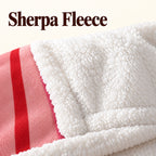 Close-up of the white sherpa fleece backing and bound edge beside the pink striped printed front