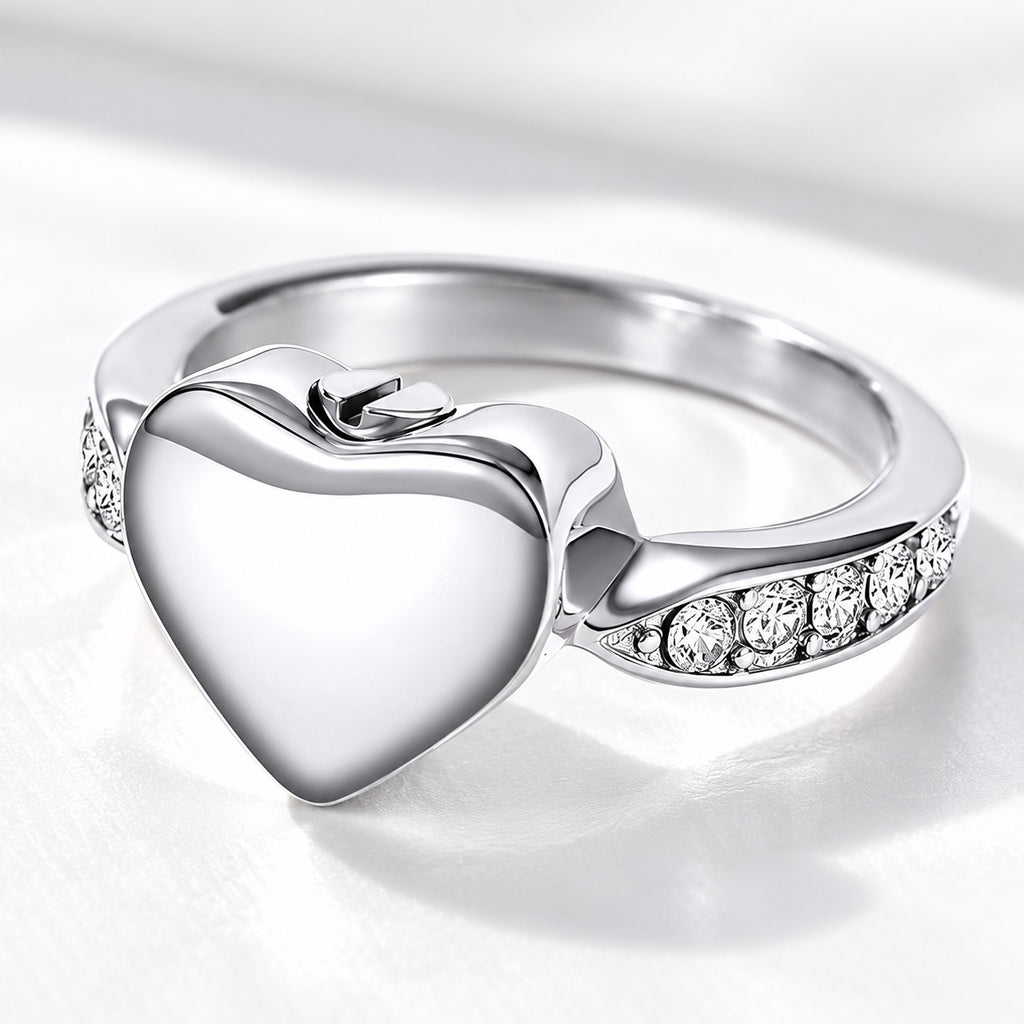 Silver heart-shaped pet ashes memorial ring with clear accent stones and screw closure