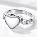 Silver heart-shaped pet ashes memorial ring with clear accent stones and screw closure