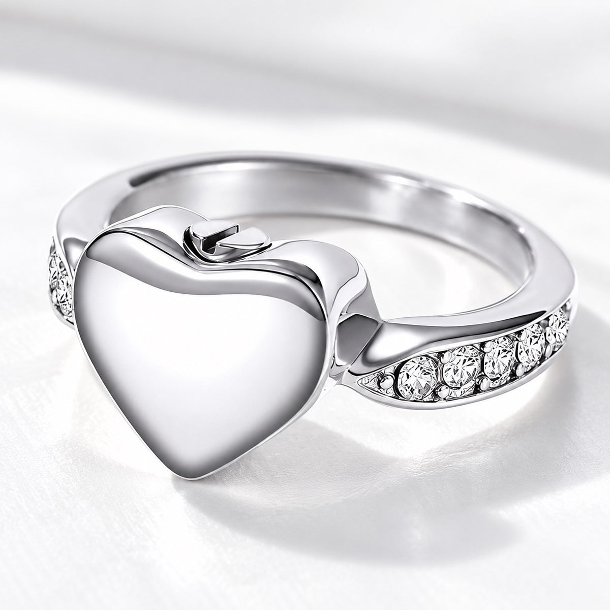 Silver heart-shaped pet ashes memorial ring with clear accent stones and screw closure
