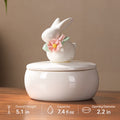 Small floral rabbit memorial urn size guide showing 5.1 inch overall height, 7.4 fluid ounce volume and 2.2 inch opening diameter