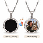 Silver color-changing photo necklace shown black before warming and revealing a pet portrait afterward