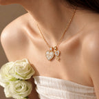 Model wearing a white heart photo locket necklace with zircon border and matching key charm