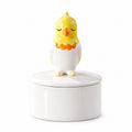 Ceramic bird memorial urn with a yellow, white and orange bird figure with closed eyes on the lid